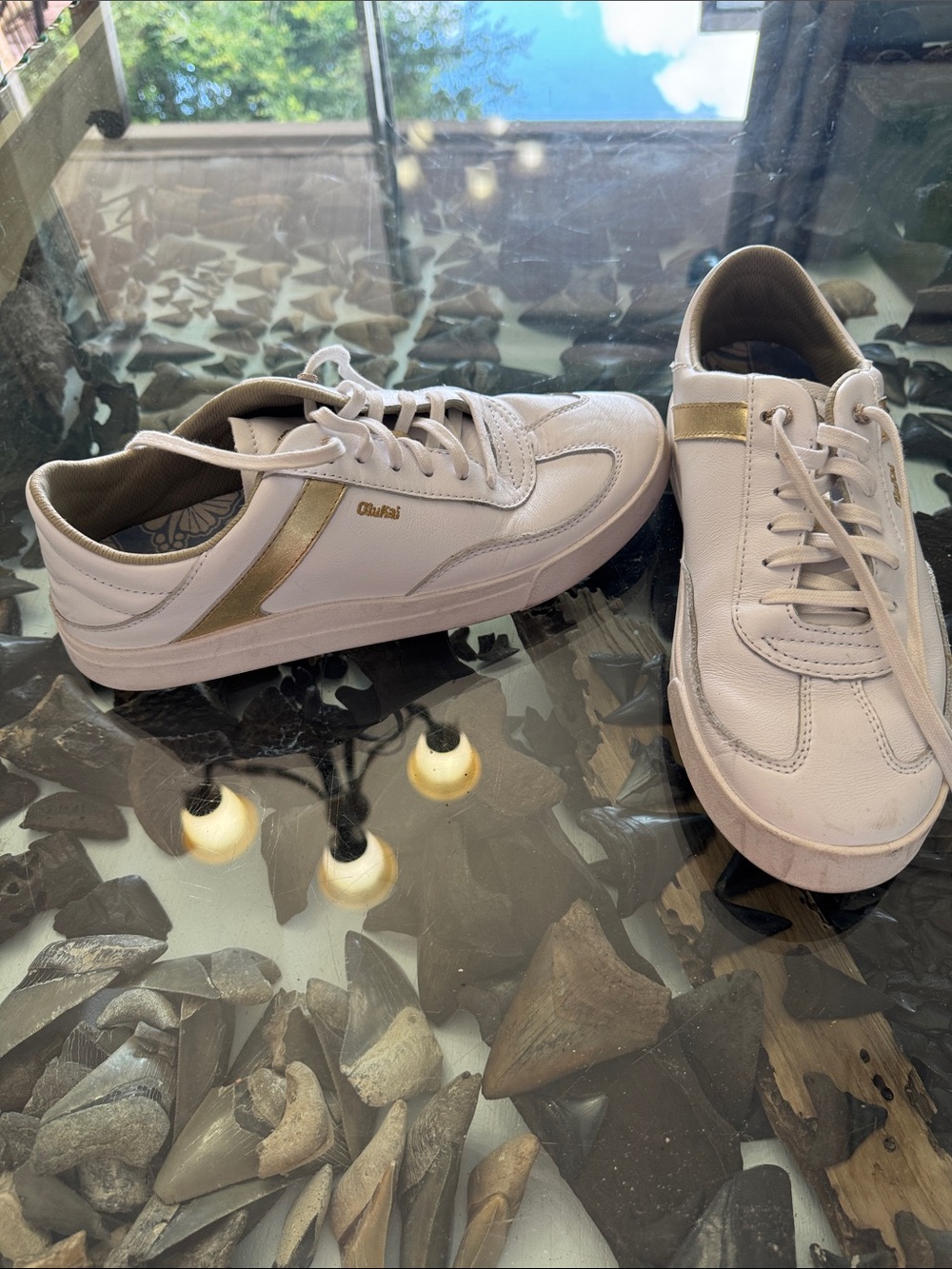 OluKai White and Gold Low-Top Sneakers